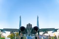 Backside and tail of the Russian fighter against the blue sky