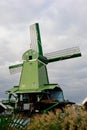 Reverse side of a traditional dutch windmill built with wood in a Netherland landscape. Royalty Free Stock Photo