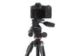 Backside view of modern multifunctional black camera on trepied isolated Royalty Free Stock Photo