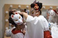 Backstage two actresses prepare for the performance