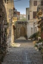 Backstreet buildings and cobblestones in Rhodes Old Town. Royalty Free Stock Photo