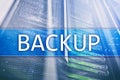 Backup button on modern server room background. Data loss prevention. System recovery