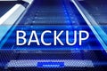 Backup button on modern server room background. Data loss prevention. System recovery