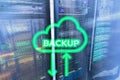 Backup button on modern server room background. Data loss prevention. System recovery