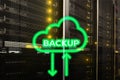 Backup button on modern server room background. Data loss prevention. System recovery