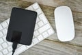 Backup data with external hard disk drive on white computer keyboard Royalty Free Stock Photo
