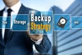 Backup Strategy touchscreen is operated by a businessman