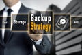 Backup Strategy touchscreen is operated by a businessman Royalty Free Stock Photo