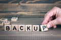 Backup. Wooden letters on the office desk, informative and communication background