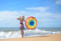 Backview of beautiful lady with rainbow umbrella Royalty Free Stock Photo