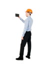 Backview of business man in construction helmet stands and enjoy Royalty Free Stock Photo