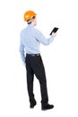 Backview of business man in construction helmet stands and enjoy Royalty Free Stock Photo
