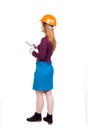 Backview of business woman in construction helmet stands and enj Royalty Free Stock Photo