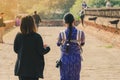 Backview of female tourists at ancient Pa Hto Taw Gyi Pagoda ruins at Mingun city