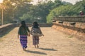 Backview of female tourists at ancient Pa Hto Taw Gyi Pagoda ruins at Mingun city, Myanmar