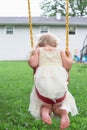 Little girl swinging barefoot Royalty Free Stock Photo