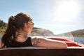 Backview from a woman in a boat, boating lake and blue sky Royalty Free Stock Photo