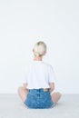 Backview woman sit look invisible object white