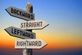 Backward, straight, leftward, rightward - wooden signpost, sunset sky