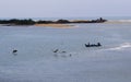 Backwater with fishermen boat and birds Royalty Free Stock Photo