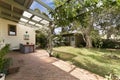 Backyard cozy patio area with wicker furniture set