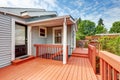 Backyard of craftsman home with red deck Royalty Free Stock Photo