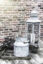 Backyard decoration with vintage milk can and lantern Royalty Free Stock Photo