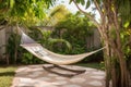 backyard escape with hammock, lounge chair and book for a lazy day in the sun