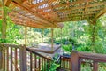 Backyard farm deck with attached open pergola Royalty Free Stock Photo