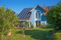 Backyard garden of a beautiful family home with solar panels on the roof