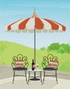 Backyard Garden Scene with Wrought Iron Chairs and striped umbrella Royalty Free Stock Photo