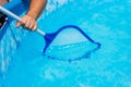 Backyard garden swimming pool cleaning close up Royalty Free Stock Photo