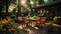 Backyard garden terrace wooden table and chair full of flowers and green tree, shadow area Royalty Free Stock Photo