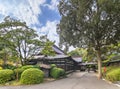 Backyard of the Miyajidake Shrine of Fukuoka adorned with rounded niwaki shrubs and a Nozura stone lantern.