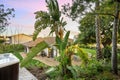 a patio, garden and hot tub on a deck in the back yard Royalty Free Stock Photo