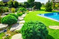 Backyard with outdoor inground residential swimming pool, garden Royalty Free Stock Photo