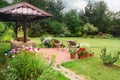 Backyard Patio Area with Fireplace and Furniture. Green Party area. Royalty Free Stock Photo