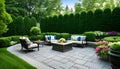 The backyard patio is outdoors, featuring a sitting area surrounded by landscaping