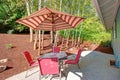 Backyard Patio With Red Striped Umbrella Royalty Free Stock Photo