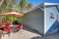 Backyard Patio view of a lovely blue remodeled home Royalty Free Stock Photo