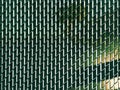 a backyard security fence chain link slats plastic linked mesh rows woven row fencing yard wire barrier privacy parallel rural Royalty Free Stock Photo