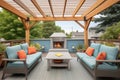 backyard setting with a pergola, fireplace, and upstairs balcony