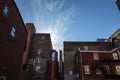 Backyard of some old, poor and dilapidated red brick buildings, of the vintage North American architectural style, in Montreal