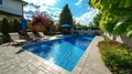 Swimming pool in luxury home with chair and trees. Royalty Free Stock Photo