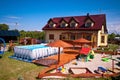 Backyard with swimming pool and sandbox