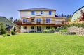 Backyard of three story house with fenced yard. Royalty Free Stock Photo