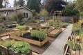 backyard with vegetable patch, flower beds, and chickens in yard