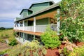 Backyard view of country three story green house