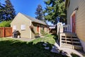 Backyard view of craftsman house with a shed Royalty Free Stock Photo