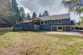 Gray home exterior with covered deck